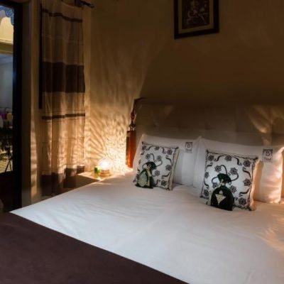 Warm and inviting guest room in Riad Dar Benbrahim with private bathroom and cultural Moroccan design elements
